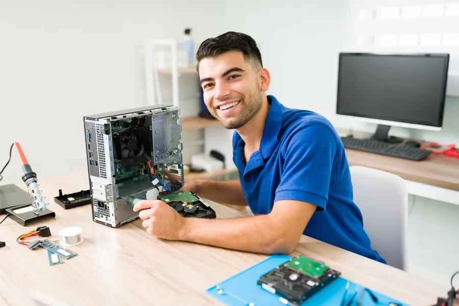 Data Recovery Professional Removing The Hard Drive From A Desktop Computer For A Hard Drive Recovery